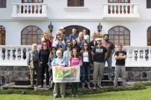 Group of travelers poses on the steps outside Villa daFiore